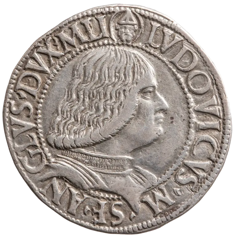 A silver coin featuring the profile of a man with long, wavy hair. The inscription around the edge includes his name, 