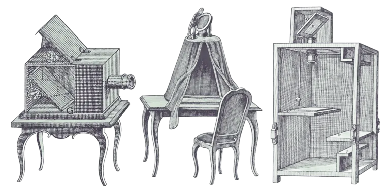 An illustration featuring three historical optical devices: the left device appears as a wooden box with shelves, the center resembles a large camera obscura with a lens, and the right shows a wooden table draped with a cloth, accompanied by a chair.