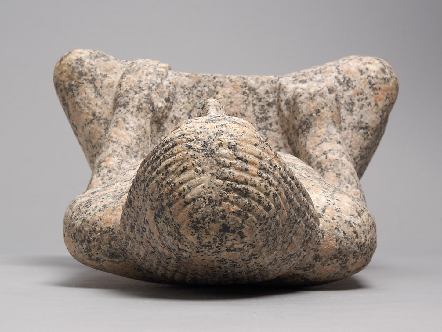 Statue of a man sitting cross-legged