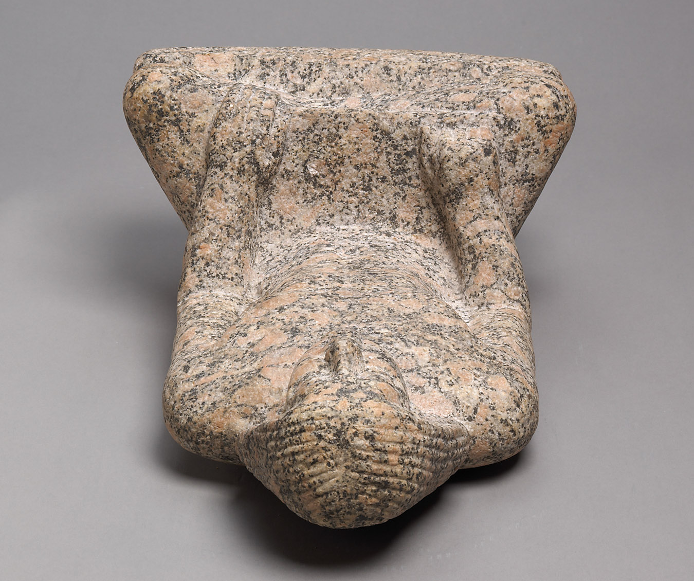 Statue of a man sitting cross-legged