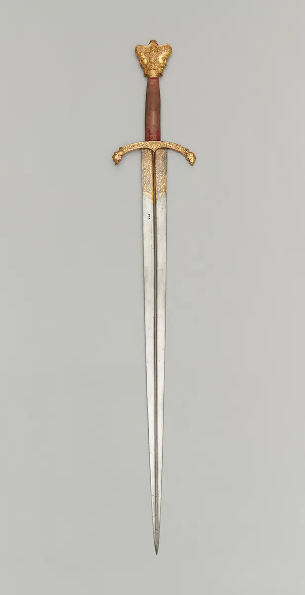 Schwert mit Krauf in Form eines Januskopfes