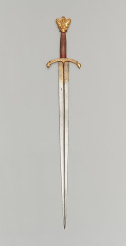 Schwert mit Krauf in Form eines Januskopfes