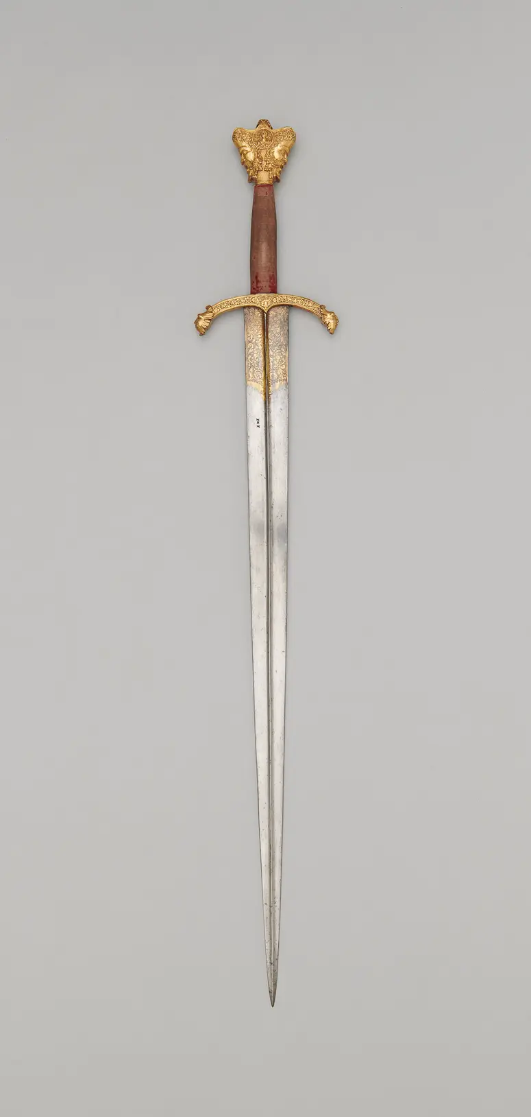Schwert mit Krauf in Form eines Januskopfes