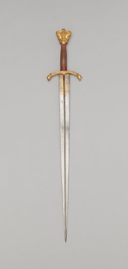 Schwert mit Krauf in Form eines Januskopfes