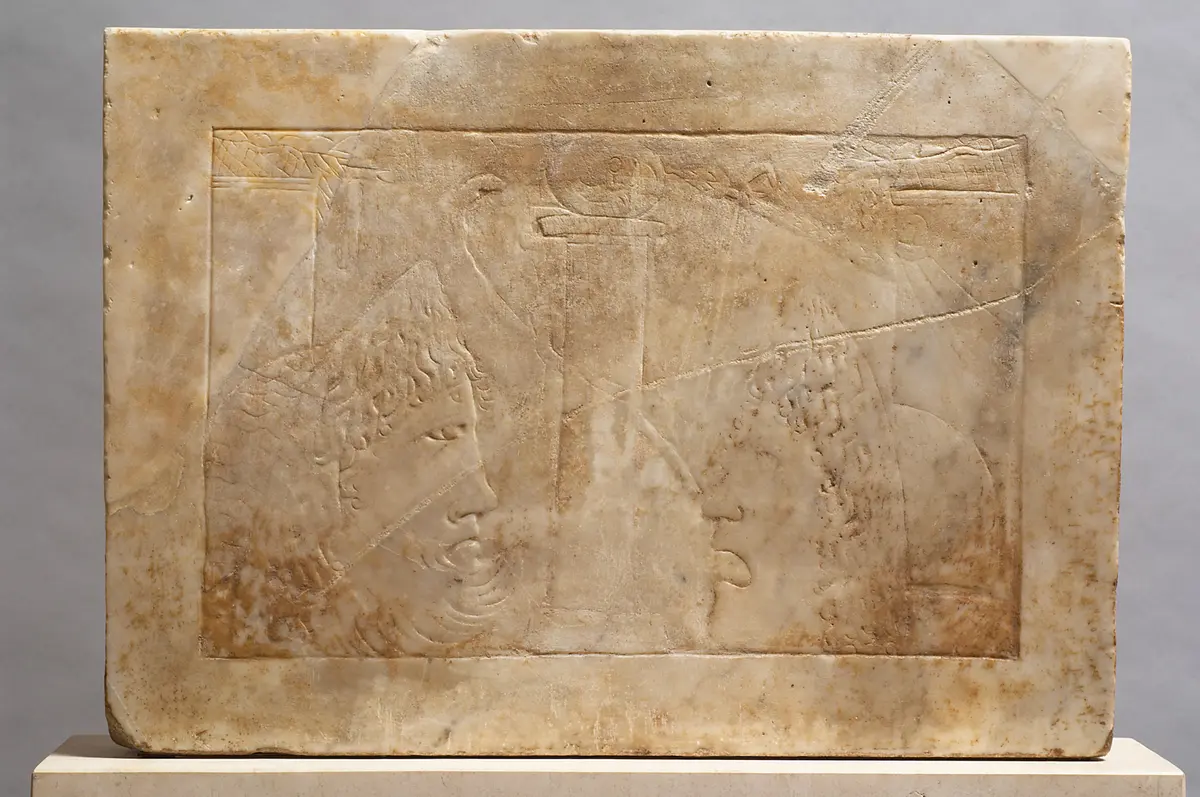 Doppelseitiges Maskenrelief