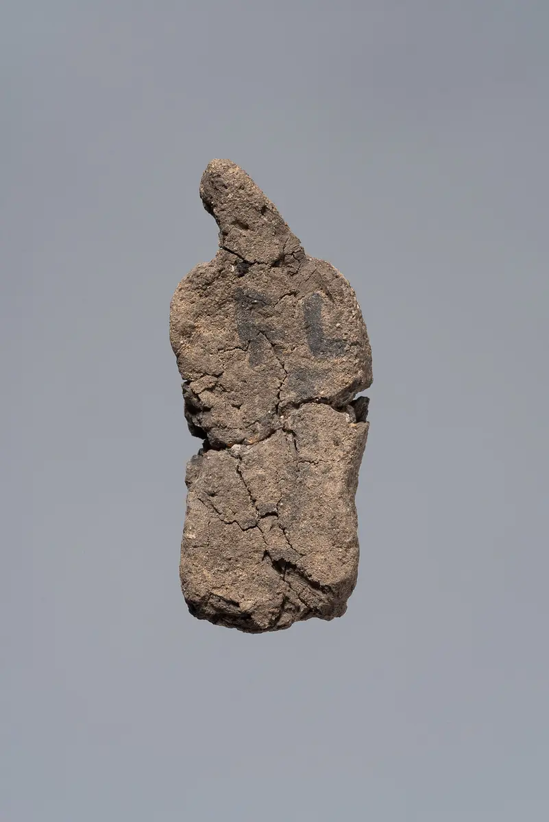 Ächtungsfigur mit Aufschrift