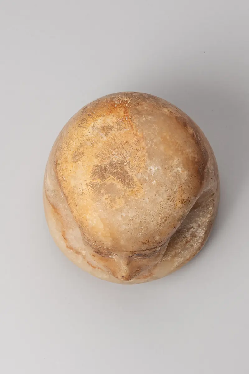 Kanopendeckel in Form eines Menschenkopfes