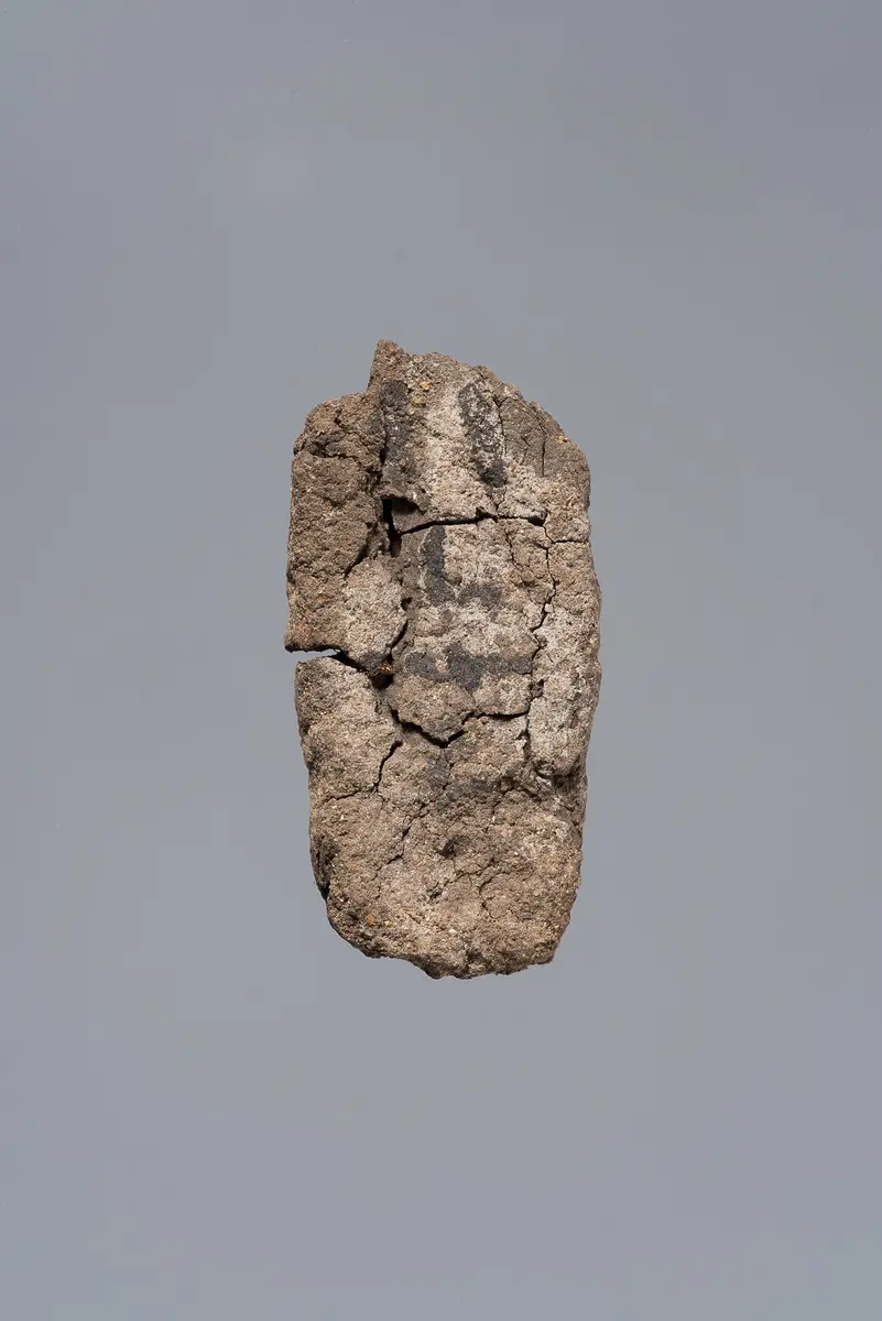 Ächtungsfigur mit Aufschrift