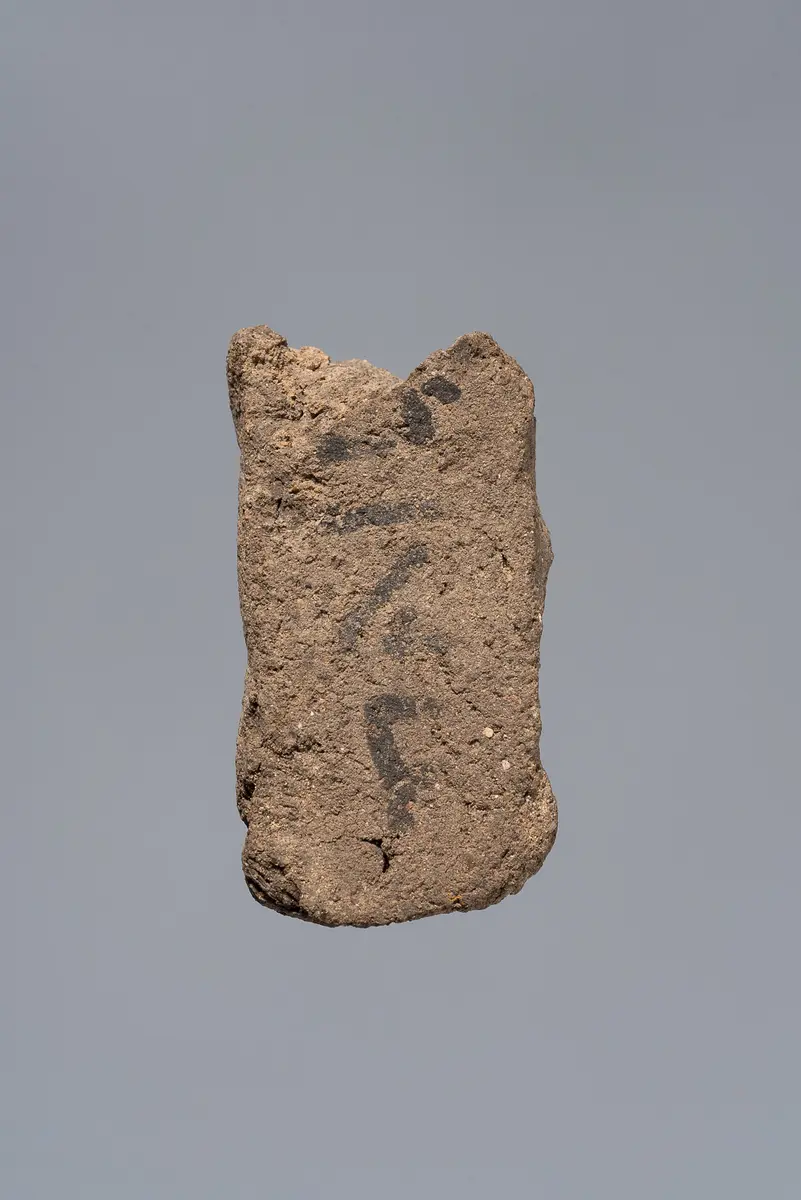 Ächtungsfigur mit Aufschrift