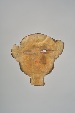 Gesicht aus einer Mumienkartonage