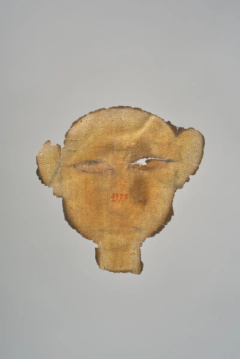 Gesicht aus einer Mumienkartonage