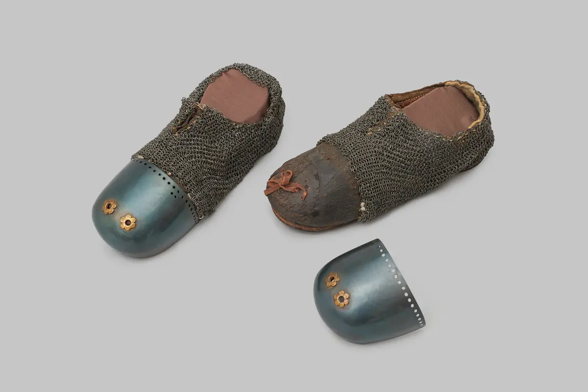 A pair of mail-reinforced leather shoes