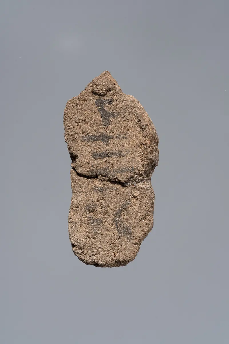 Ächtungsfigur mit Aufschrift