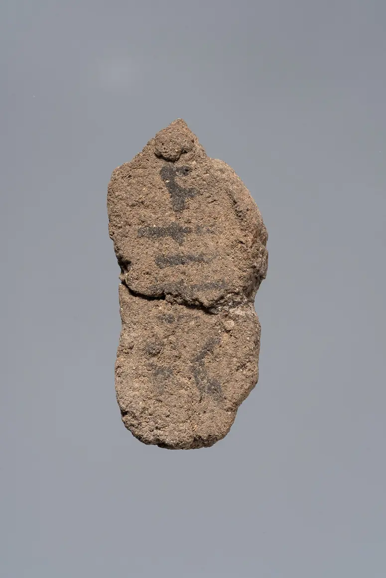 Ächtungsfigur mit Aufschrift