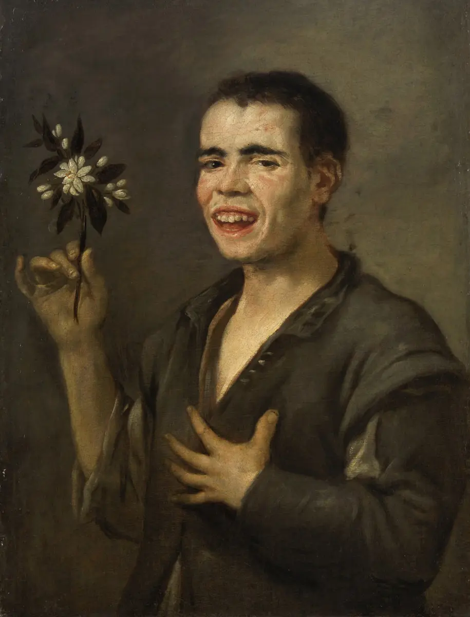 Lachender Bursche mit Orangenblüte