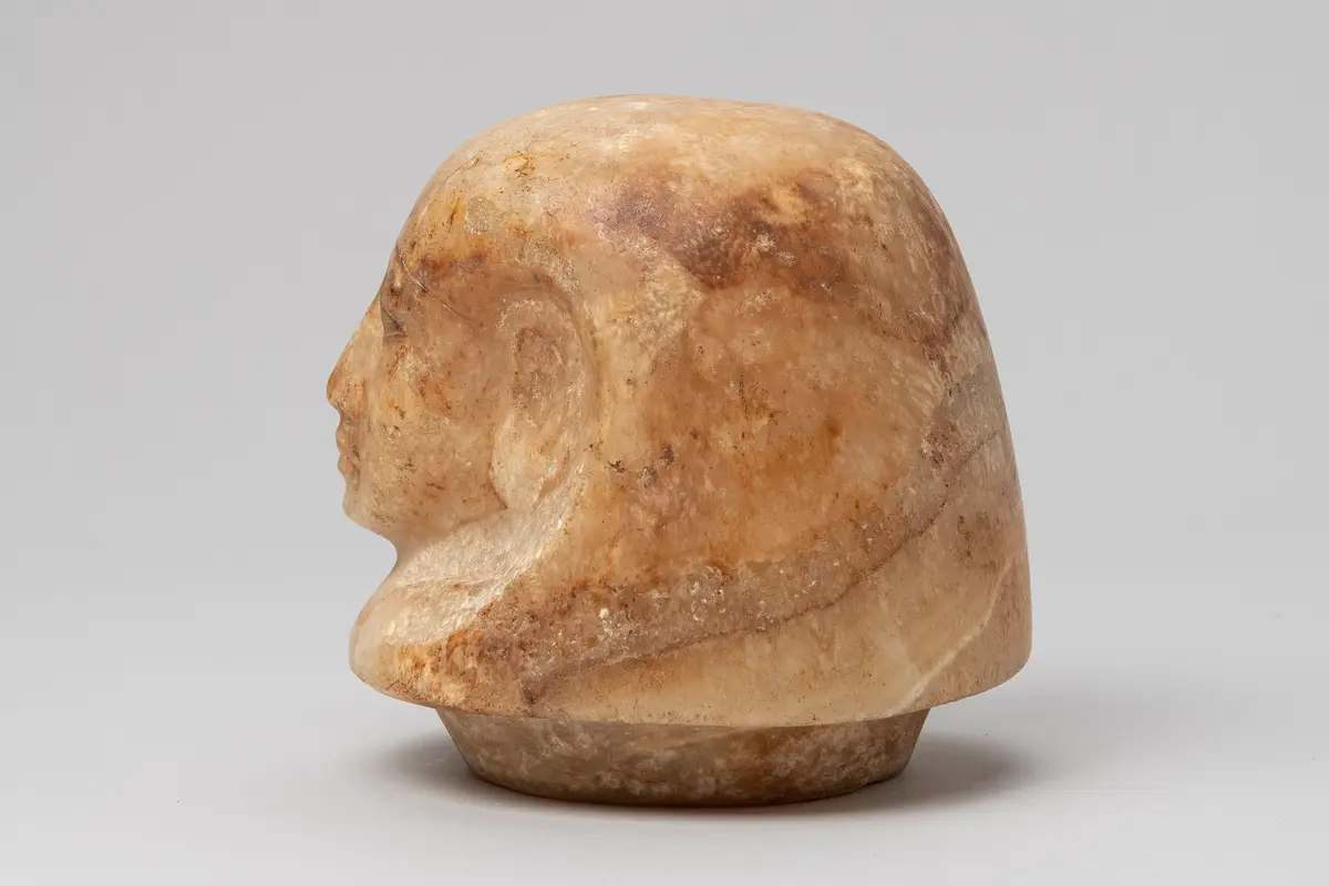 Kanopendeckel in Form eines Menschenkopfes