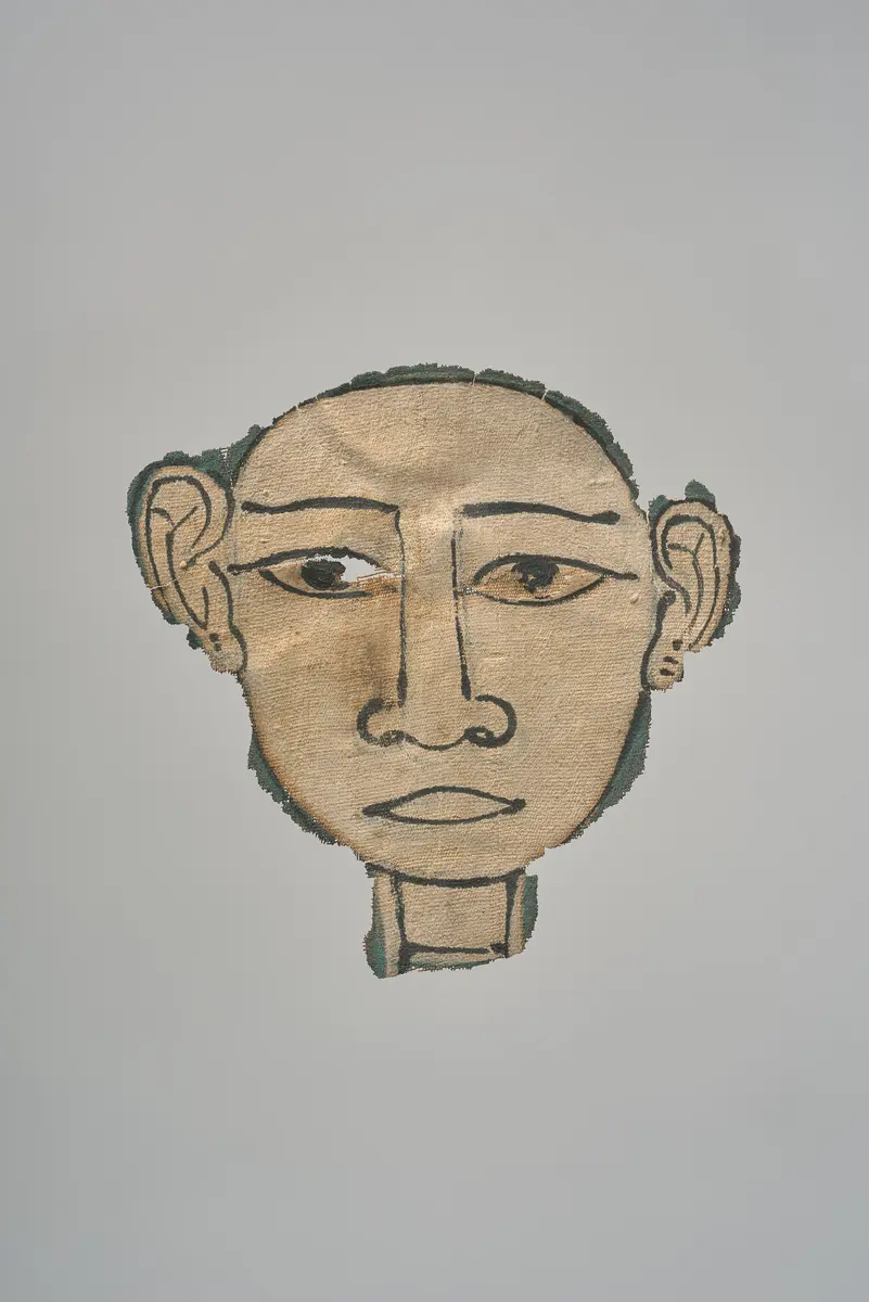 Gesicht aus einer Mumienkartonage