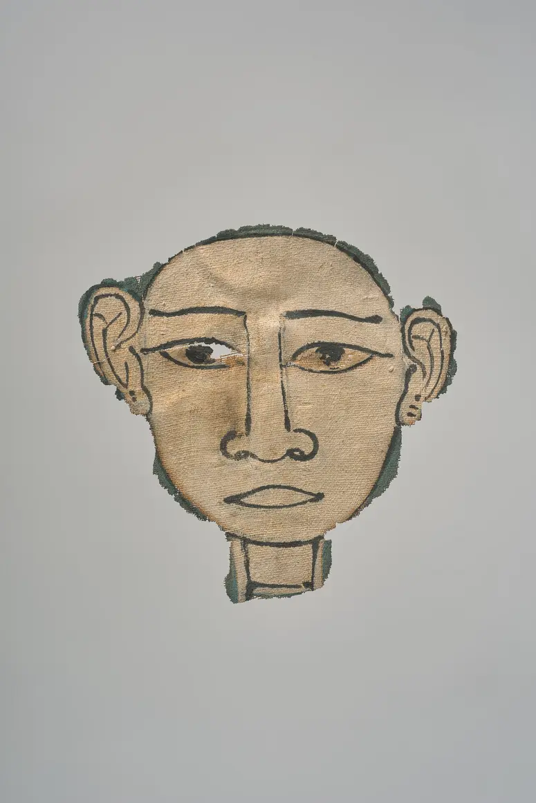 Gesicht aus einer Mumienkartonage