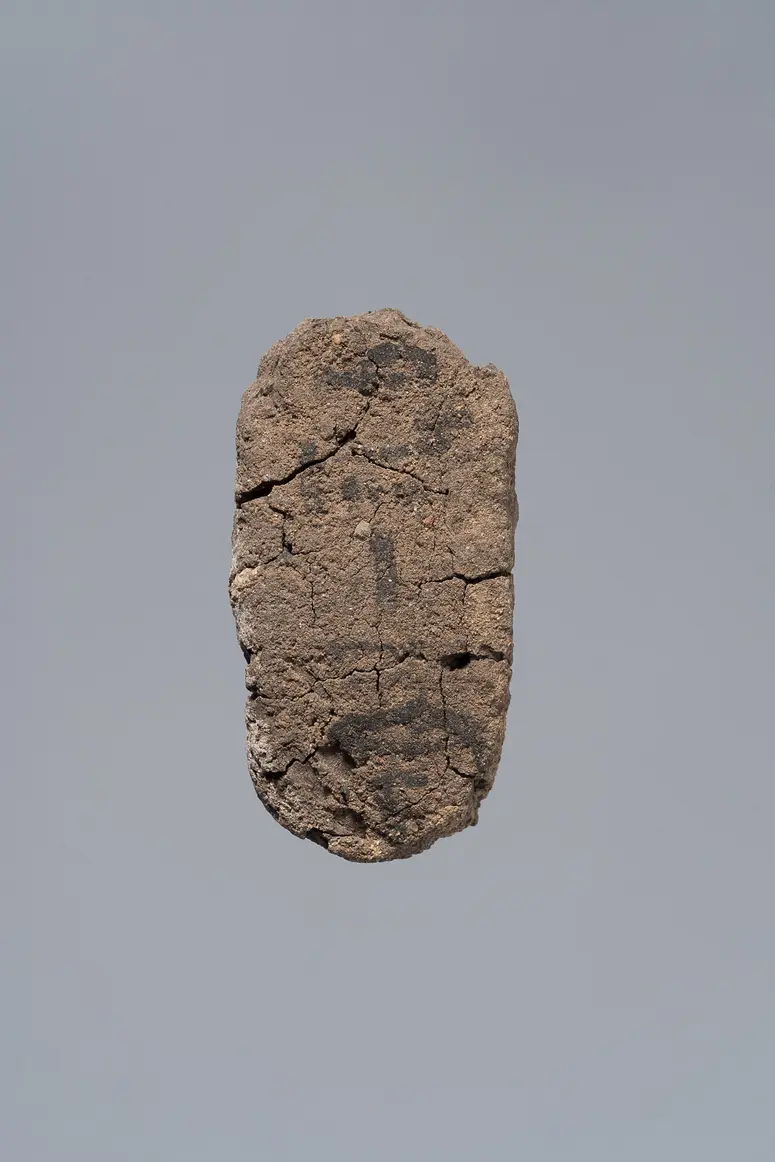 Ächtungsfigur mit Aufschrift
