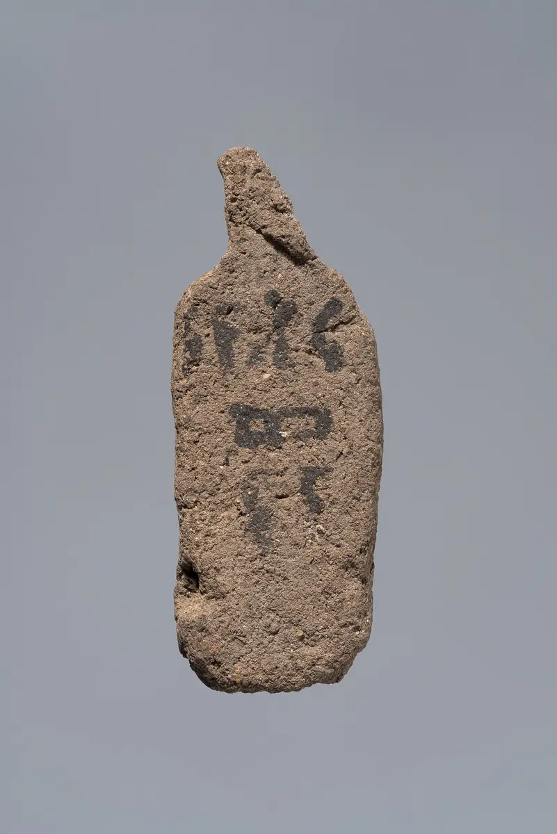 Ächtungsfigur mit Aufschrift