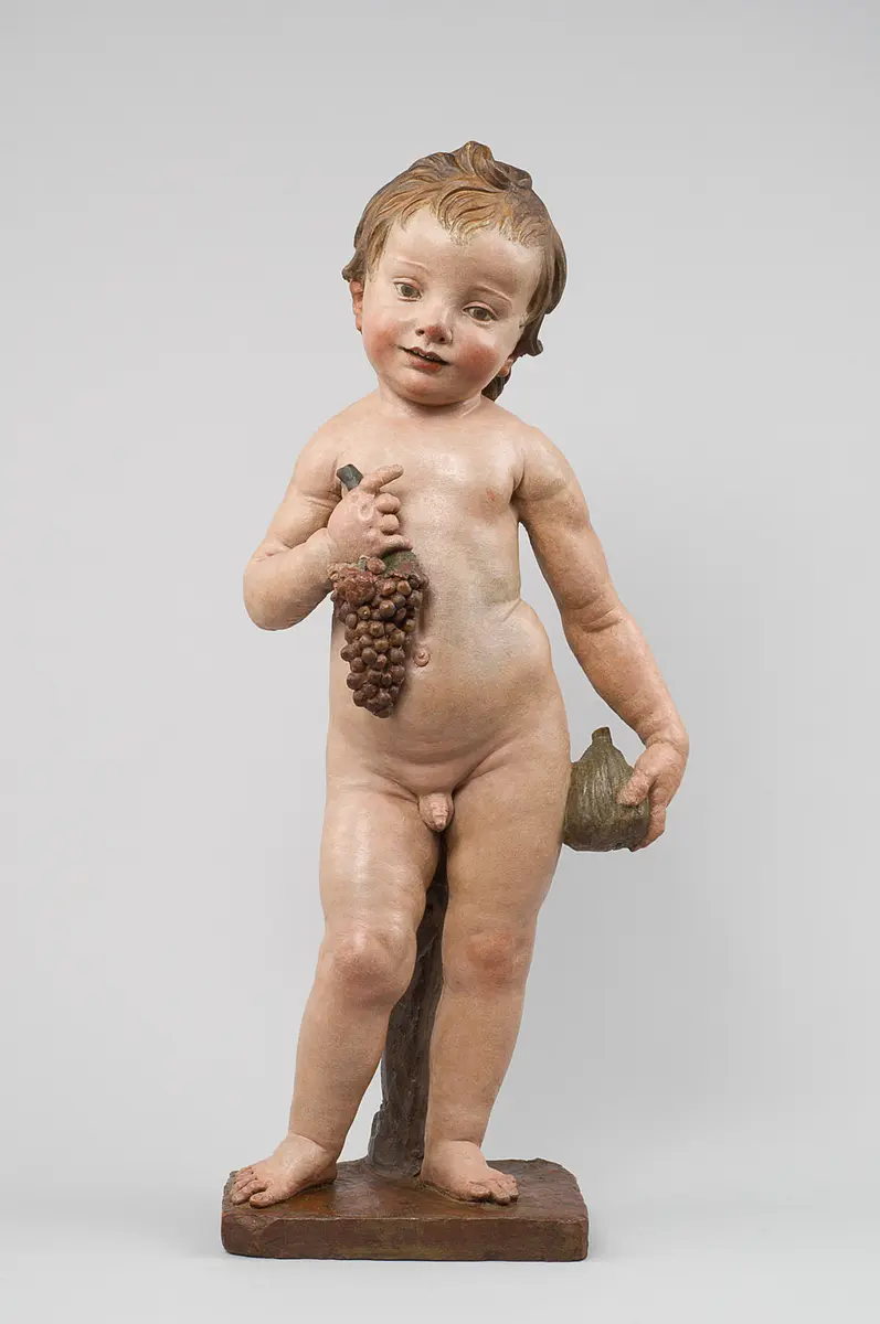 Putto oder Christusknabe mit Feige und Weintraube